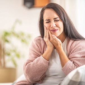 Grimacing woman with toothache