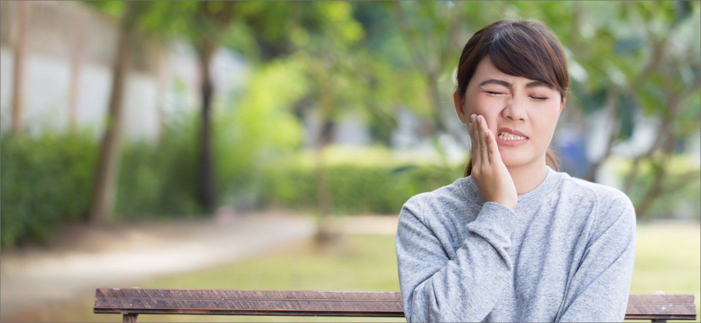 Woman in pain before emergency dentistry