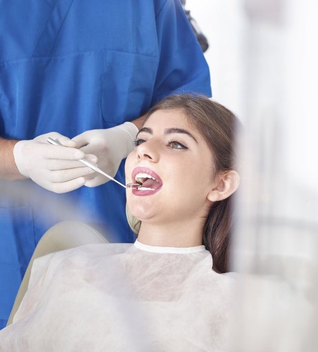 Woman receiving emergency dentistry treatment