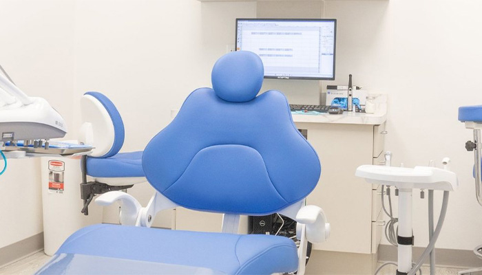 Blue dental chair in dentist's office