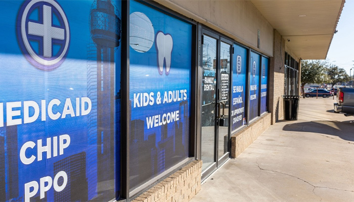 Outside shot of office with blue signs