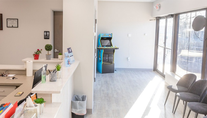 Dental office waiting room with an arcade machine