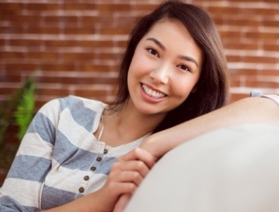 Woman smiling after sedation dentistry visit