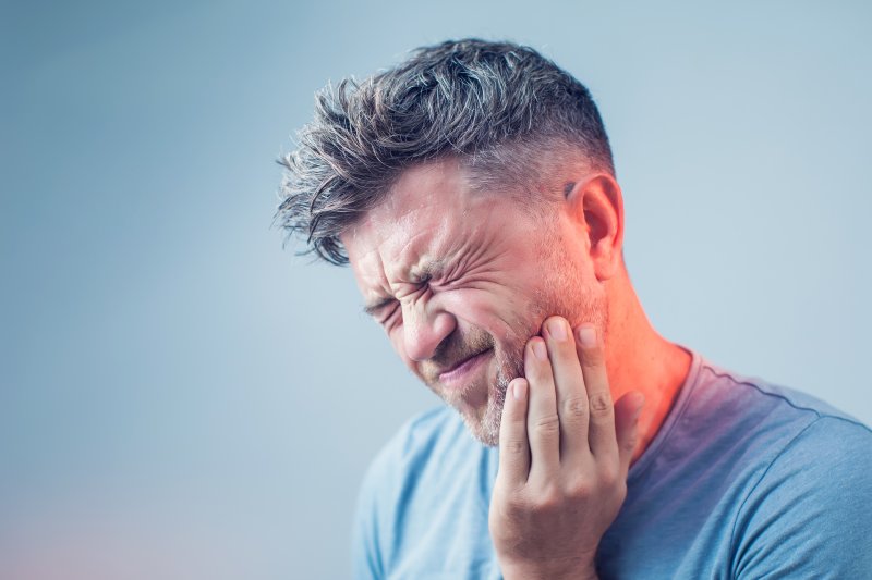 Portrait of a man wincing in pain